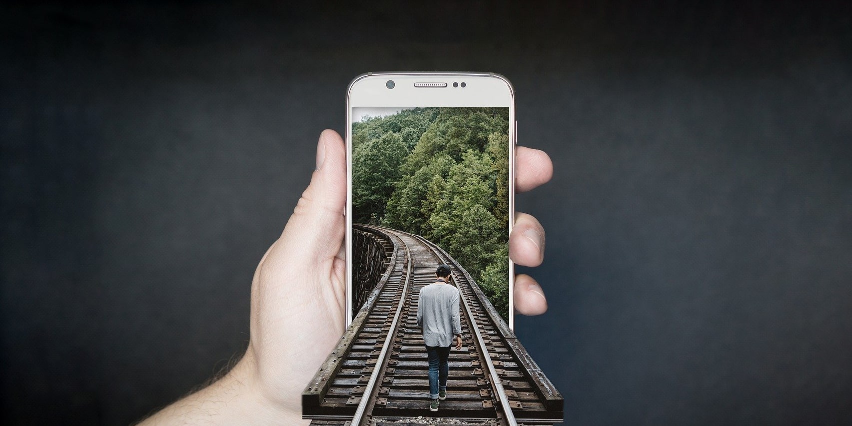 a railway track going into a smartphone