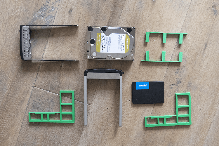 a selection of drives, hot swap trays, and brackets
