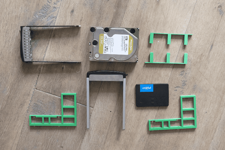 a selection of drives, hot swap trays, and brackets