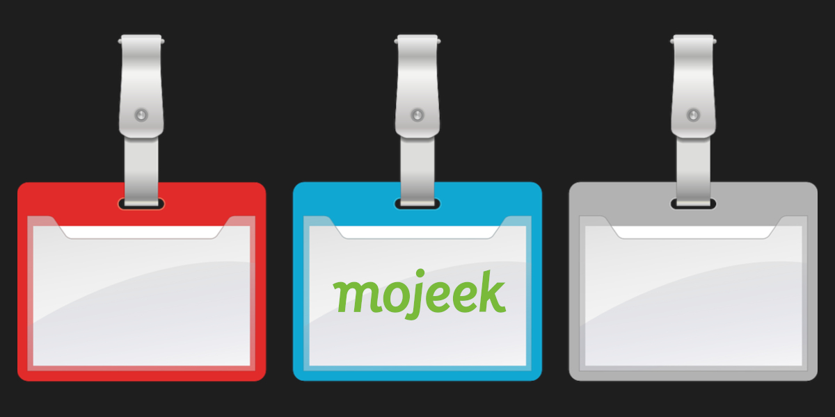 Three name tags, the one in the center has the Mojeek logo in it.