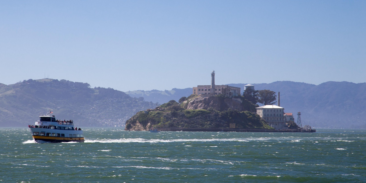 A boat leaving Alcatraz, a former prison in San Francisco Bay.